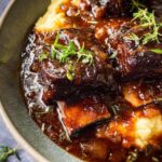 Plated pellet-grill red wine braised short ribs